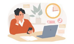 Person sitting at a desk with a smartphone, laptop, papers, and a clock showing 10:09.