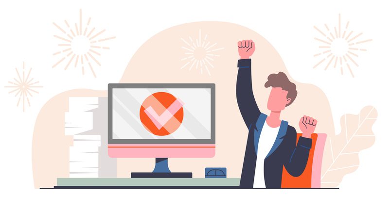 Person celebrating at a desk with arms raised, a computer screen showing a large checkmark, papers stacked nearby, and fireworks in the background.