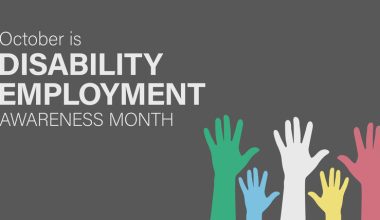 Graphic with gray background featuring the text 'October is DISABILITY EMPLOYMENT AWARENESS MONTH' and five raised hands in various colors.