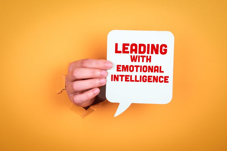 Leading with Emotional intelligence. Speech bubble in woman hand.